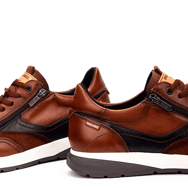 Zapatos de calzado casual para hombre en cuero marrón y negro con suela antideslizante y diseño moderno. Perfectos para estilo y comodidad diaria.