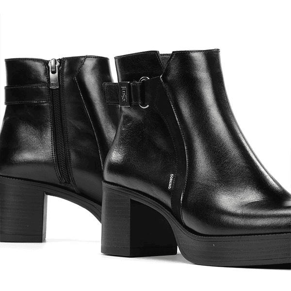 Botines de cuero negro con tacón alto y cierre lateral, calzado de moda para mujer.
